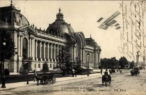 Ak Paris, L'Aviation, H. Farman Doppeldecker fliegt über der Avenue Nicolas II