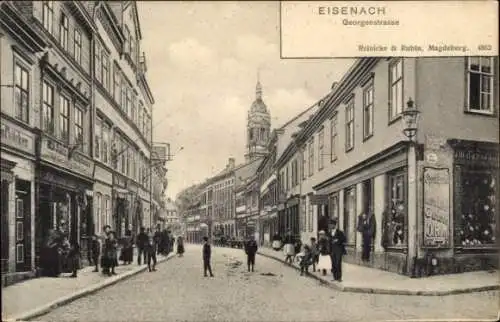 Ak Lutherstadt Eisenach in Thüringen, Blick in die Georgenstraße, Geschäft J. Reiss, Wilh. Schütz