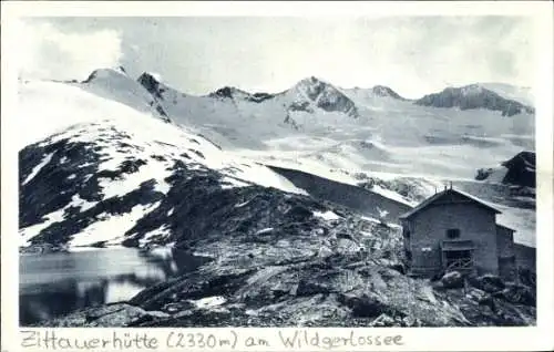 Ak Krimml Salzburg, Zittauerhütte am Wildgerlossee mit der Reichenspitze