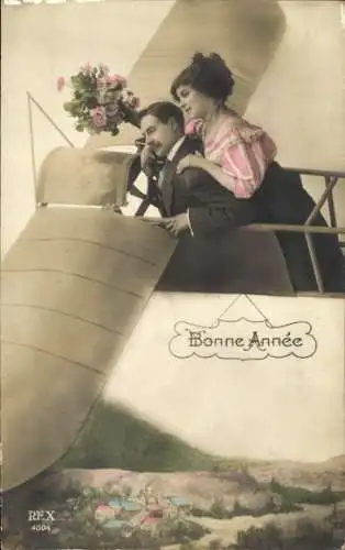 Ak Glückwunsch Neujahr, Paar in einem Flugzeug, Fotomontage