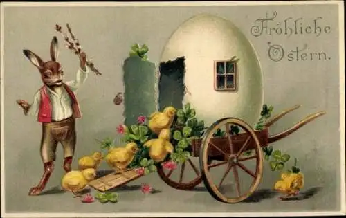 Präge Ak Glückwunsch Ostern, Eierhaus auf einem Handkarren, Küken, Kleeblätter, Hase