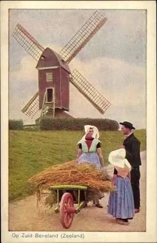 Ak Zeeland, Op Zuid Beveland, Frau mit Strohkarren, Windmühle, Trachten