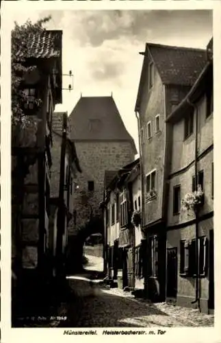 Ak Bad Münstereifel in Nordrhein Westfalen, Heisterbacher Straße mit Tor