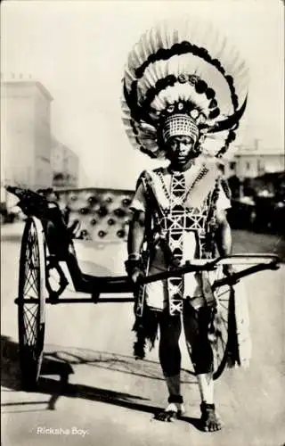 Ak Südafrika, Ricksha Boy, Afrikanischer Rikschafahrer, Hörnerhelm