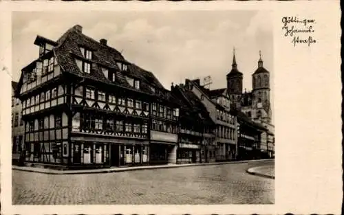 Ak Göttingen in Niedersachsen, Geschäfte in der Johannisstraße, Kirche, Fachwerkbau