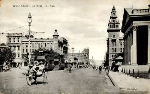 Ak Durban Südafrika, West Street Central, Rikschafahrer, Straßenbahnen Richtung Beach und Point