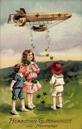 Präge Ak Glückwunsch Namenstag, Zeppelin wirft Kleeblätter ab