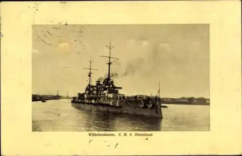 Ak Wilhelmshaven, S.M.S. Rheinland im Hafen, Ansicht Bug Steuerbord