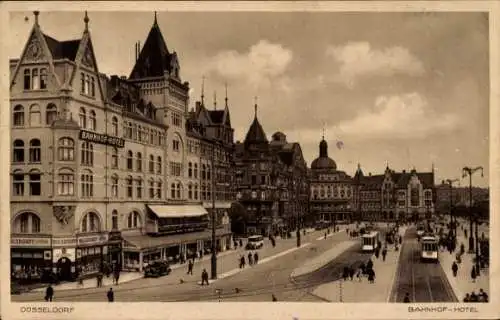 Ak Düsseldorf am Rhein, Bahnhof-Hotel, Straßenbahnen