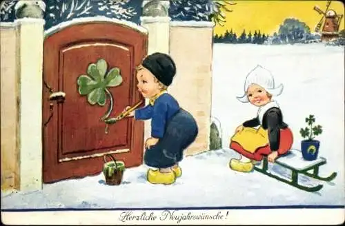 Künstler Ak Wills, John, Fröhliches Neujahr, Kinder in niederländischer Tracht, Junge malt Kleeblatt