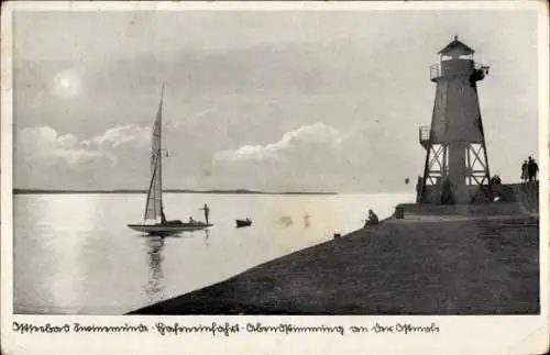 Ak Świnoujście Swinemünde Pommern, Hafeneinfahrt, Abendstimmung von der Ostmole