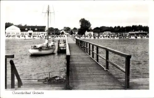 Ak Ostseebad Grömitz in Holstein, Strand, Boot, Brücke