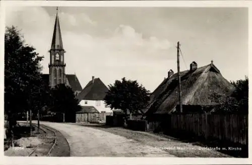 Ak Ostseebad Wustrow, Dorfstraße mit Kirche