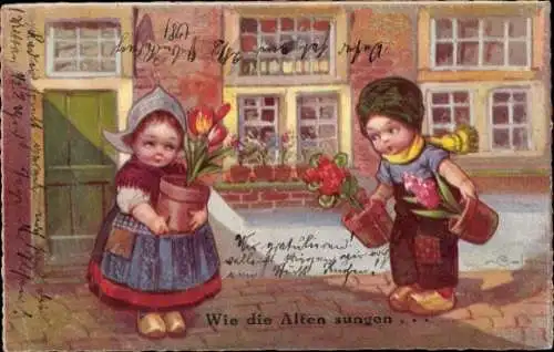 Künstler Ak Colombo, E., Kinder in niederländischer Tracht, Geschenke, Wie die Alten sungen...