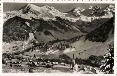 Ak Mittelberg Vorarlberg, verschneiter Ort mit Hammerspitze und Schafeleköpfen