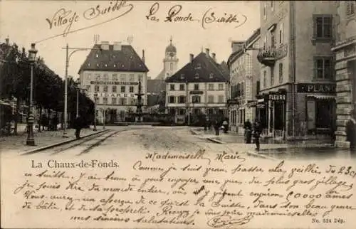 Ak La Chaux de Fonds Kanton Neuenburg, Straßenpartie, Geschäfte