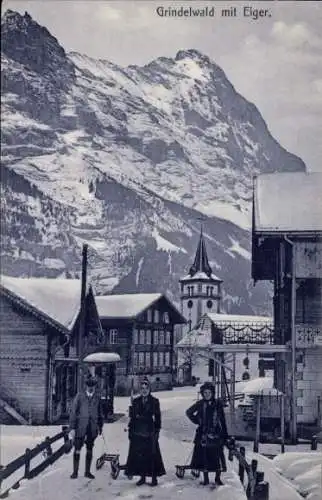 Ak Grindelwald Kanton Bern, Dorfpartie im Winter mit Schlitten, Eiger
