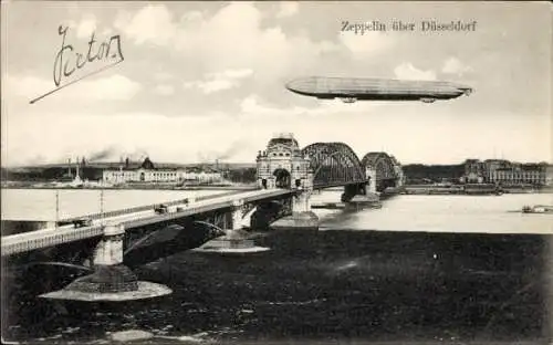 Ak Düsseldorf am Rhein, Zeppelin über der Stadt, Brücke