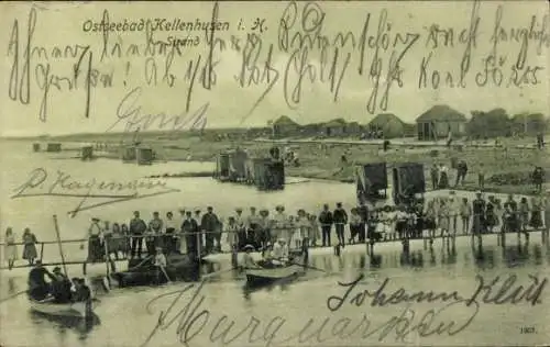 Ak Ostseebad Kellenhusen in Holstein, Strand, Personen auf einem Steg