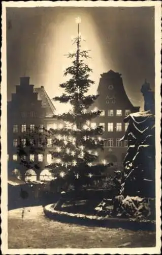 Foto Ak Flensburg in Schleswig Holstein, Nacht, Winter, Tannenbaum