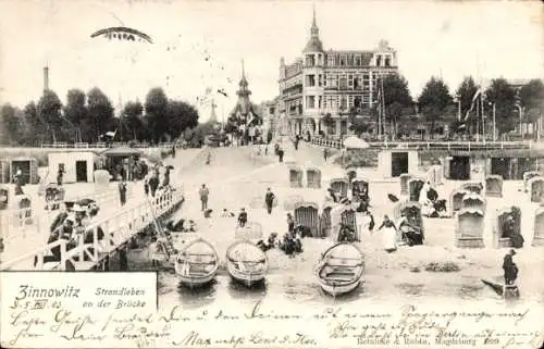 Ak Ostseebad Zinnowitz auf Usedom, Strandleben an der Brücke