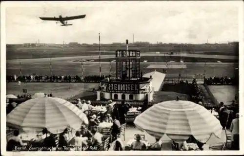 Ak Berlin Tempelhof, Zentralflughafen Tempelhofer Feld, Flugzeug, Reklame Heinkel