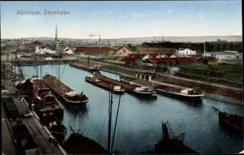 Ak Karlsruhe, Frachtschiffe im Rheinhafen, Stadtblick