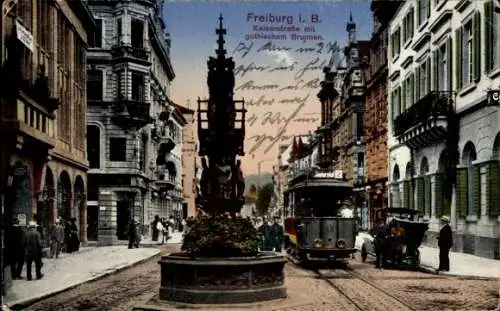 Ak Freiburg im Breisgau, Kaiserstraße, gothischer Brunnen, Straßenbahn nach Günterstal