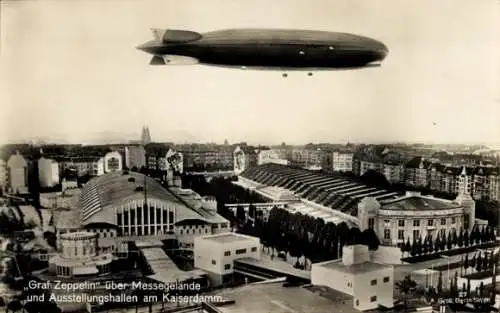 Ak Berlin Charlottenburg, LZ 127 Graf Zeppelin über Messegelände u. Ausstellungshallen am Kaiserdamm