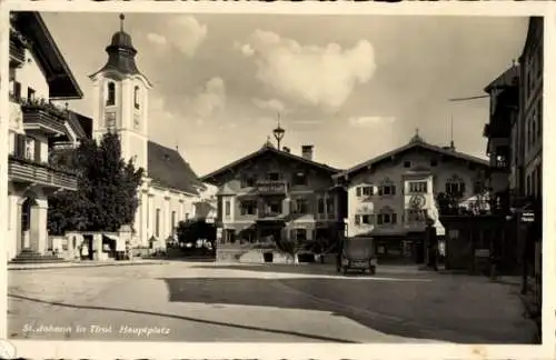 Ak St. Johann in Tirol, Partie am Hauptplatz, Cremin Zapfsäule, Zahn Atelier Hans Gausch, Kirche