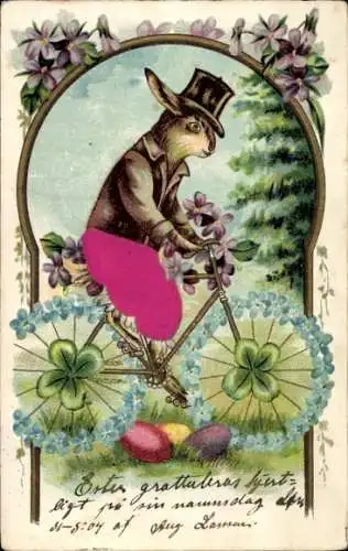 Stoff Präge Litho Glückwunsch Ostern, Osterhase auf einem Fahrrad, Ostereier, Kleeblätter