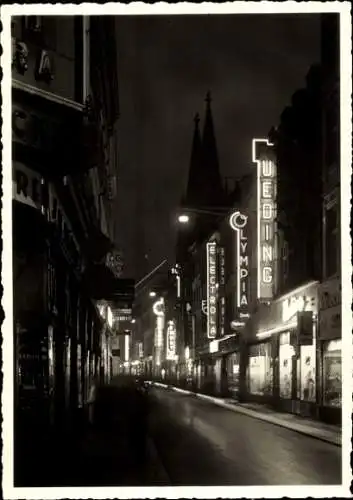 Ak Köln am Rhein, Hansestadt, Unter Goldschmid, Abendansicht, Leuchtreklame