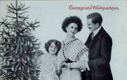 Ak Glückwunsch Weihnachten, Familie am Tannenbaum