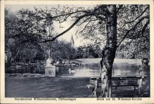 Ak Wilhelmshaven an der Nordsee, Teilansicht, Park, Willehad-Kirche, Schwäne, Sitzbank