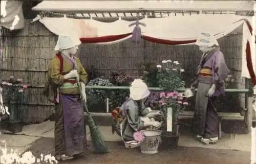 Ak Japan, Mädchen in Tracht am Blumenstand