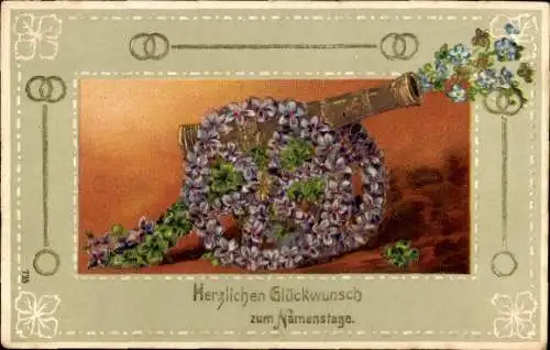 Präge Ak Glückwunsch Namenstag, Kanone aus Blumen, Veilchen, Glücksklee