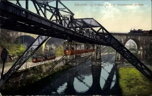 Ak Elberfeld Wuppertal, 3 Bahnen an der Sonnborner Brücke, Schwebebahn, Eisenbahn, Straßenbahn