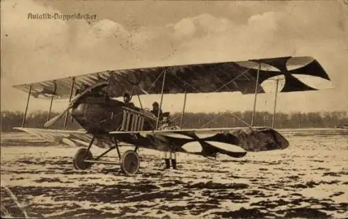 Ak Aviatik Doppeldecker, Flugzeug am Boden, Sanke