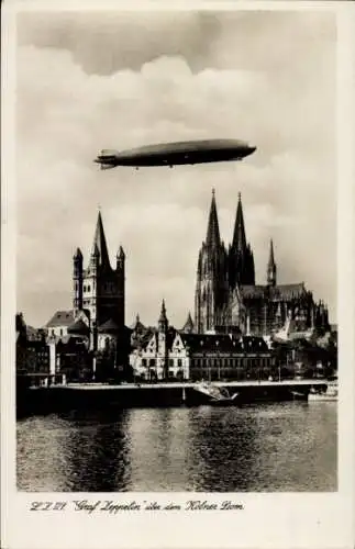 Ak Luftschiff LZ 127 Graf Zeppelin über dem Kölner Dom