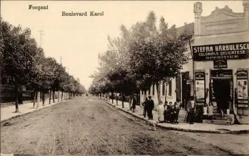 Ak Focșani Fokschan Rumänien, Boulevard Karol, Kolonialwaren Stefan Barbulescu