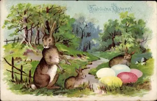 Ak Frohe Ostern, Osterhasen mit Ostereiern auf Wiese