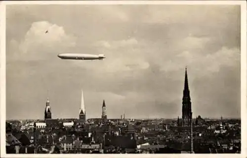 Ak Hamburg, Luftschiff LZ 127 Graf Zeppelin über der Stadt