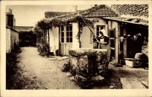 Ak Domino Ile d'Oléron Charente Maritime, Coin rustique, Frau am Brunnen