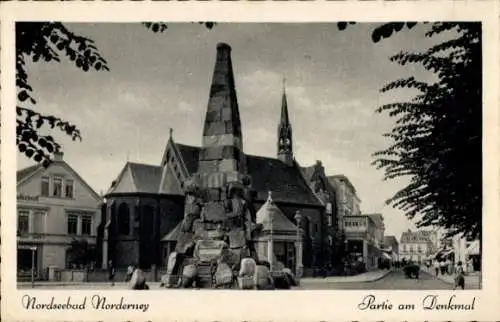 Ak Norderney Nordseebad, Denkmal mit Kirche und Straßenpartie