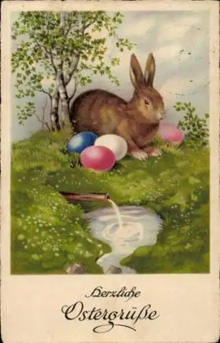 Ak Frohe Ostern, Osterhase sitzt mit Ostereiern auf Wiese