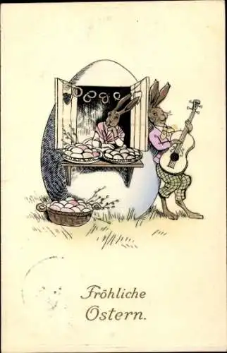 Ak Glückwunsch Ostern, Vermenschlichte Hasen, Gitarre, Eierhaus