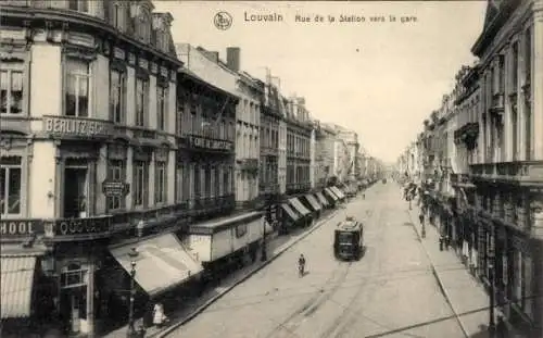 Ak Louvain Leuven Flämisch-Brabant, Rue de la Station, Straßenbahn, Quo Vadis, Berlitz-Schule