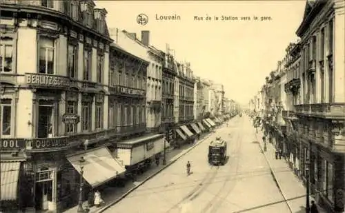 Ak Louvain Leuven Flämisch Brabant, Rue de la Station, Straßenbahn, Quo Vadis, Berlitz School