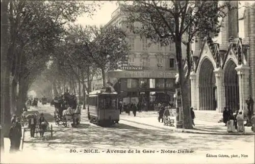 Ak Nice Nizza Alpes Maritimes, Avenue de la Gare, Notre-Dame, Straßenbahn