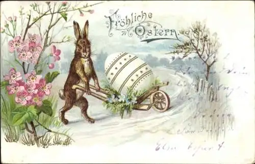 Litho Glückwunsch Ostern, Vermenschlichter Hase mit Ei auf einer Schubkarre